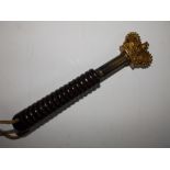 A 19thC tipstaff with gilt brass crown terminal on ring turned wooden handle, 7.25”