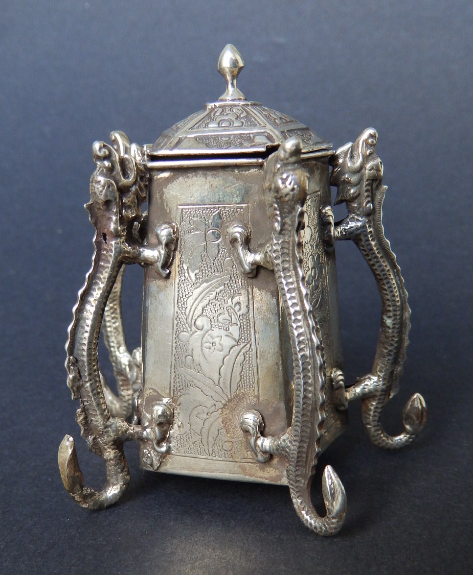 A small 19thC Chinese silver pentagonal mustard pot (?) with hinged cover and five dragon