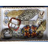 A collection of 11 enamelled & paste set buckles.