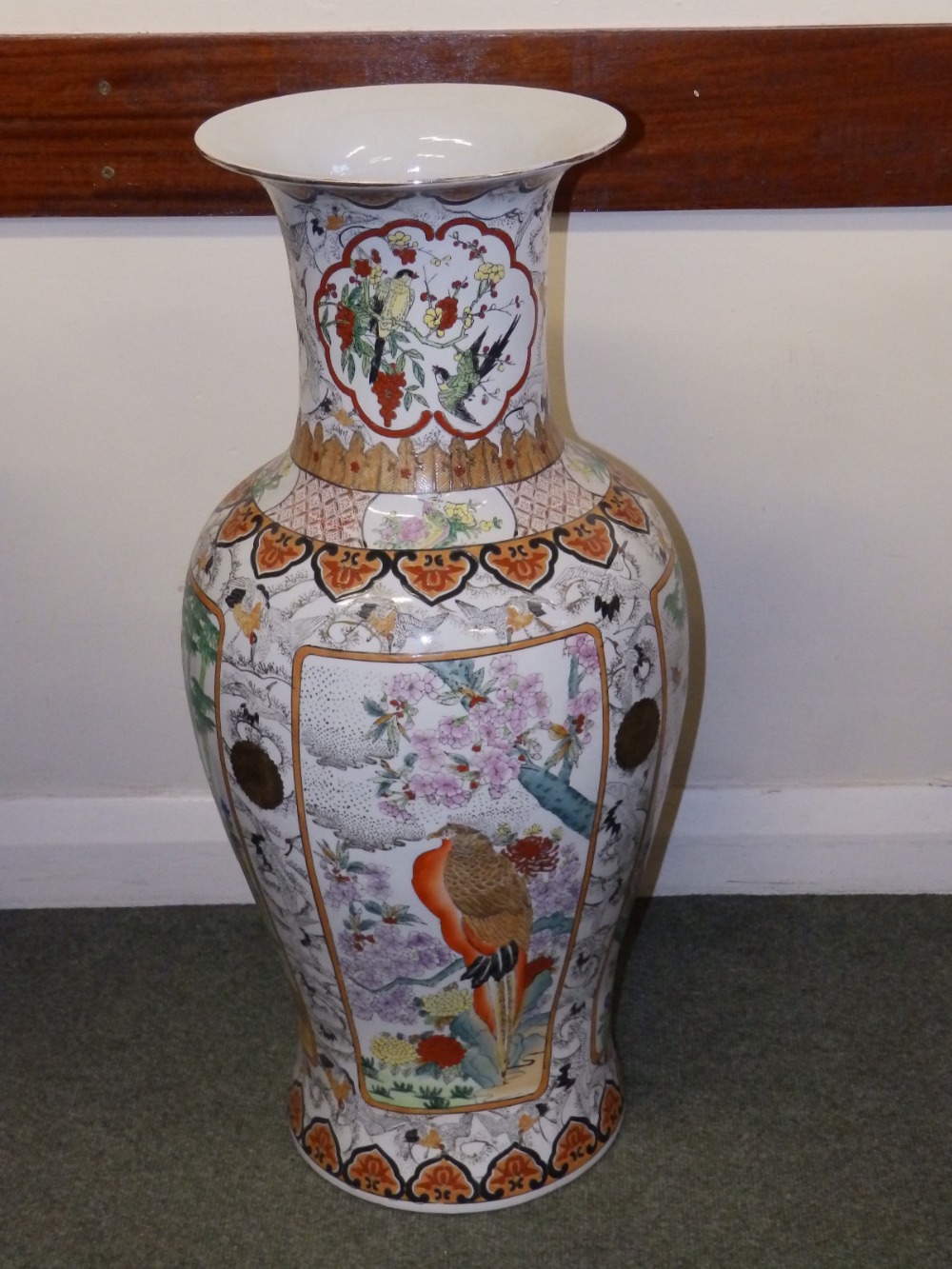 A large 20thC Chinese porcelain vase decorated with birds in panels, 32.5” high.