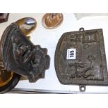A Herring's Patent Frireproof Safe label and an iron bookend figural plaque. (2)