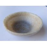 A Chinese translucent stone bowl, lightly patterned overall with arabesque scrolls to exterior and