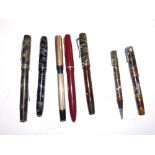 An early 20thC 14ct rolled gold cased fountain pen, a Mentmore 'Diploma' pen, two damaged marbled