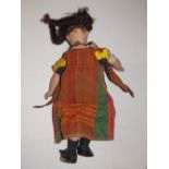 A bisque head girl doll with brown fixed glass eyes dressed in arab costume, 16” overall