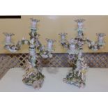 A pair of Dresden style 19thC triple branch candelabra , 12” – one re-stuck.