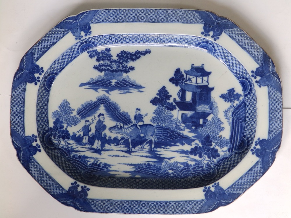 A Victorian blue & white printed earthenware chinoiserie meat dish decorated with a buffalo and