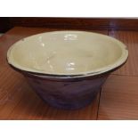 A 19thC terracotta ware cream bowl, 17” diameter.