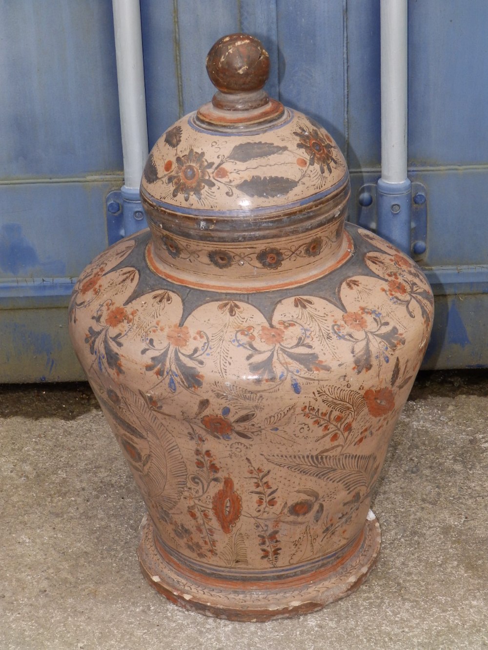 A large 19thC painted earthenware covered vase, 24” overall height – finial a/f.