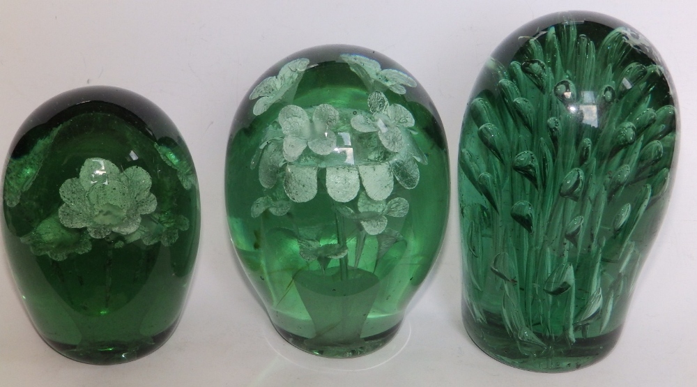 Three Victorian green glass dumpies – the largest 6”.