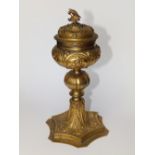 A late 17th/early 18thC gilt copper ciborium, the detachable cover having dove finial, later white