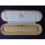 A certified natural saltwater pearl necklace with diamond clasp, comprising 67 pearls ranging from