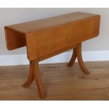 A drop leaf table by John Makepeace, the rectangular top on stretcher supports with thick square
