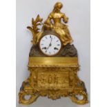 A 19thC parcel gilt French ormolu mantel clock striking on a bell, with silk pendulum suspension