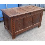 A late 17th/early 18thC carved & inlaid oak coffer, having triple panels to front with lozenge