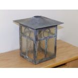 A small square copper hanging lantern.