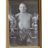 A small signed photograph of Henry Cooper.