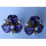 A pair of amethyst & pearl set flowerhead earrings.