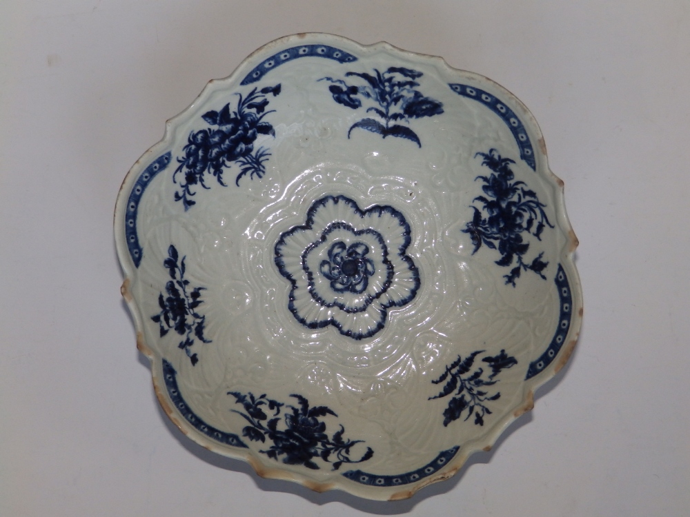 An 18thC blue & white Worcester salad dish – open crescent mark, 9.25” diameter – rim damaged.