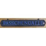 An old brass railway (?) sign with blue enamelled lettering 'PASSCHENDAELE' – possibly First World