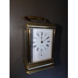 A French brass alarum carriage clock striking on a gong, retailed by F. Phillips , Aldershot, 5.3”