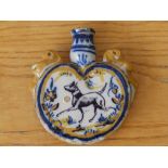 An antique delft flask painted in blue & ochre with a dog to one side and rabbits to the other, 5”