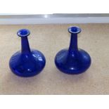 A pair of Victorian Bristol blue glass carafes, 7.5” high. (2)