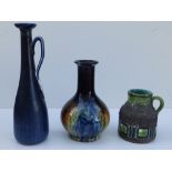 Two Swedish art pottery jugs and a streak glazed bottle vase. (3)