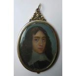 A 17thC oval portrait miniature in oils on copper – bust length portrait of a young gentleman with