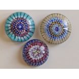 A millefiori paperweight, , 3.25” and two others. (3)