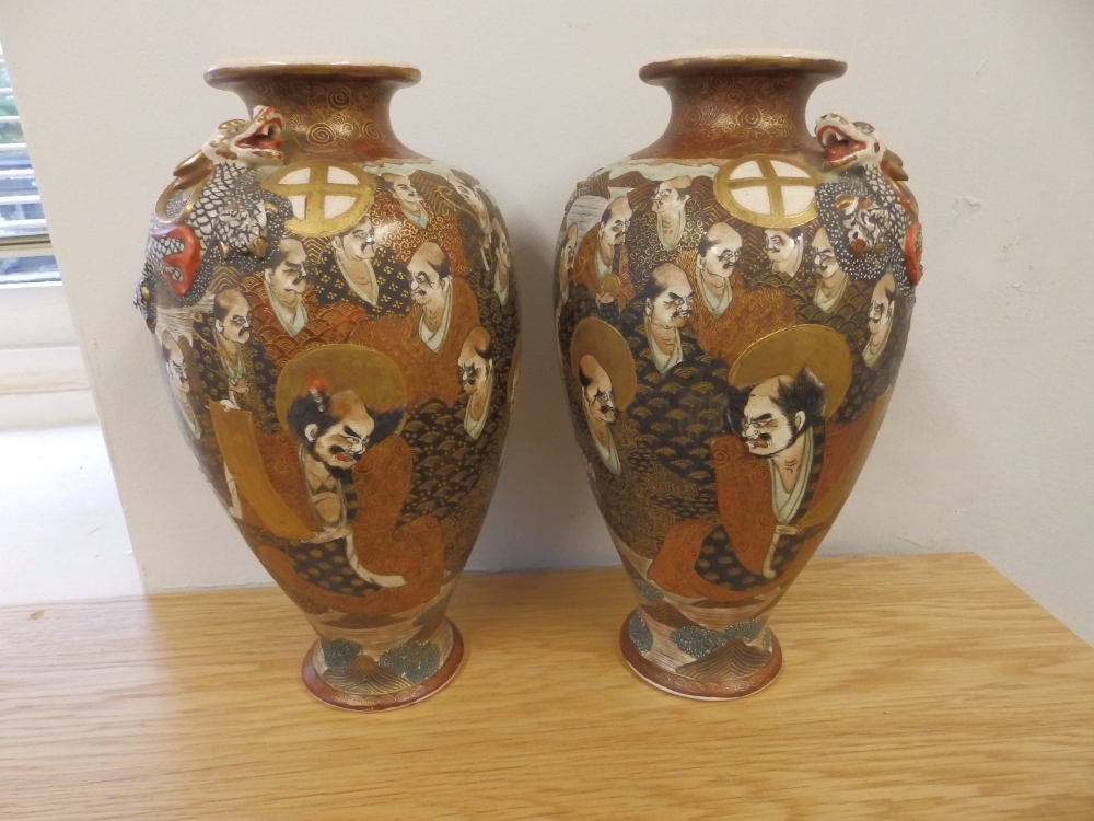 A pair of Japanese Satsuma vases, 10.5” high.