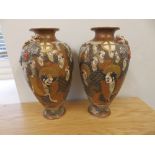 A pair of Japanese Satsuma vases, 10.5” high.