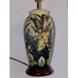 A modern Moorcroft Pottery tube lined lamp decorated bulrushes and lilies on cream ground, 11”