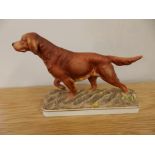 A Royal Worcester matt glazed Irish Setter by Doris Lindner, 7.75” across.