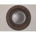 A Swiss carved wooden circular dish..