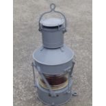 A painted metal masthead lamp – 'Not Under Command 1944'.