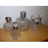 A London silver mounted cut glass scent bottle and five others. (6)