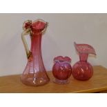 Two small cranberry glass vases and a jug – handle a/f. (3)