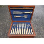 A late Victorian canteen of EP ivory-handled fish cutlery and mother-of-pearl tea cutlery with