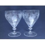 A pair of 19thC engraved glass rummers with wheel engraved grape vine decoration, 6” High