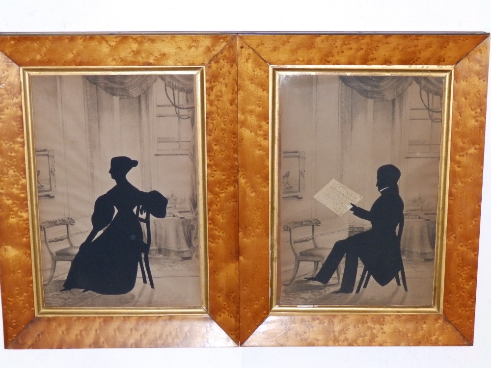 A pair of 19thC silhouettes by M. Locke, 1838 – a lady and a gentleman overlaid onto a printed