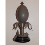 An Australian 'emu egg' white metal desk ornament, modelled with a small kangaroo & emu to the