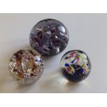 An old paperweight with three mercury stemmed striped flowerheads, 3” diameter, another and a