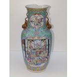 A 19thC Chinese famille rose porcelain vase, having tiger handles to shoulders, panels depicting