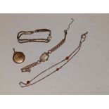A 9ct lady's wrist watch on plated strap, a locket, necklace and a bracelet. (4)