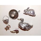 A Birmingham silver rabbit pin cushion – A&L Ld, 1907, a damaged duck pin cushion, a small shoe, a