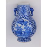 A 19thC Chinese blue & white porcelain vase of Hu form, the cartouche panels painted with scholars