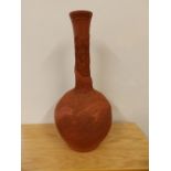 An Oriental red stoneware bottle vase with seal mark, 14.5” high.