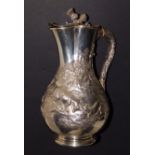 A Victorian silver presentation claret jug by Robert Hennell, having a Scottish theme, the hinged