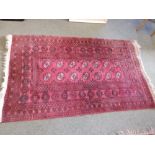 A 20thC Afghan rug – 5'11” x 3'7”.