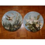 A pair of French Longwy Pottery chargers painted naturalistic birds, 17”.